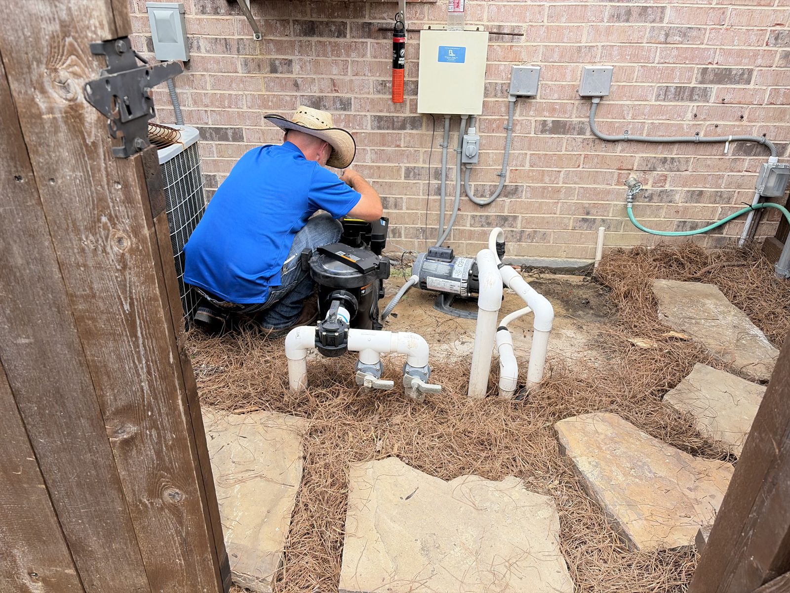 McEwan Pools repairing pump and valves at a pool equipment pad